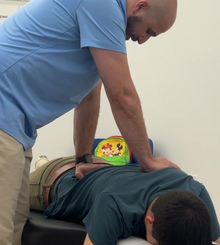 Dr. Armen treating a patient's back